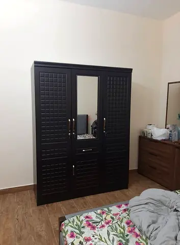 Stylish black colour 3door cabinet available
