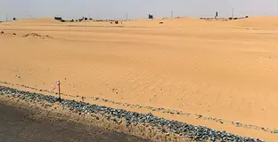 Commercial land for sale in Al Sahma 2, with an area of 18,000 square feet.