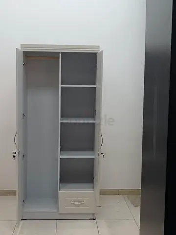 Stylish White Wardrobe with Shelves and Drawer