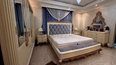 Luxurious King Size Bed with Elegant Wardrobe and Dresser
