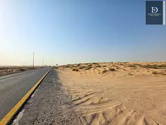 Commercial land for sale in Al Sahma, directly on Khorfakkan Street