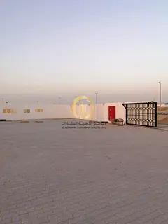 For sale: a plot of land in Emirates Industrial City, excellent location next to the village auction