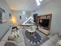 Sharjah, Al Khan area: Two bedrooms and a living room, furnished with a balcony. Rent is 5500 AED in