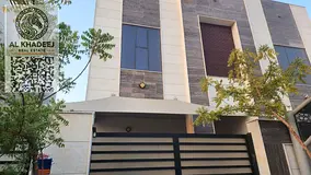 A villa in the heart of Al Yasmin district, Ajman, featuring spacious living areas, a modern design,