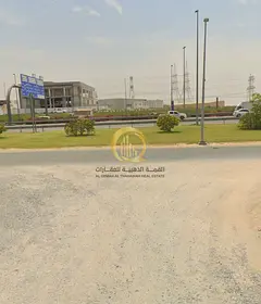 A corner plot on three commercial streets, directly on the main road (Maliha Street), with a very di