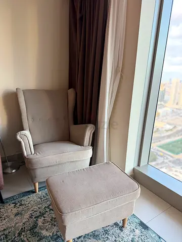 Cozy Armchair with Footstool for Relaxing Evenings