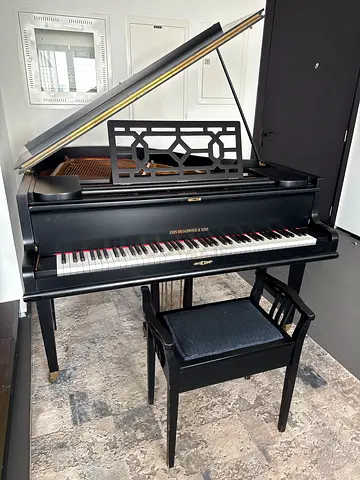 Black Baby Grand Piano with Matching Bench. Loved and used.
