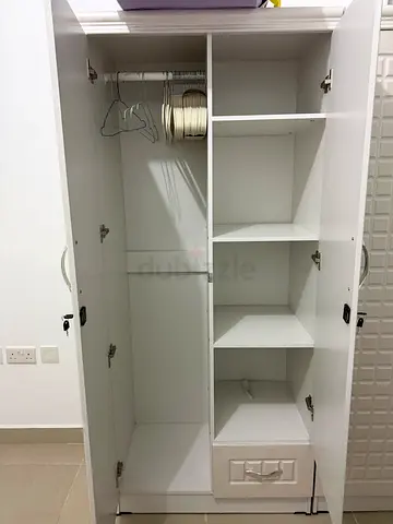 Spacious White Storage Cabinet for Sale with single beds semi new