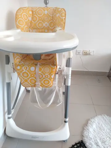 Gently Used giggles Baby High Chair in Bright Yellow