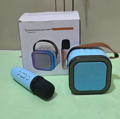Mini wireless karaoke speaker with mic and  funny voice changing futures