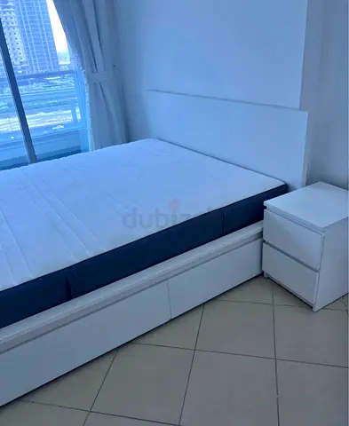 Stylish White Bed Frame with Comfortable Mattress