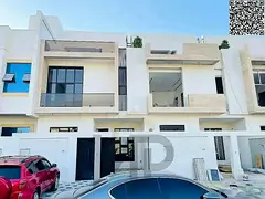 Luxury villa for sale, including registration fees, electricity, and water, in one of Ajman's mo
