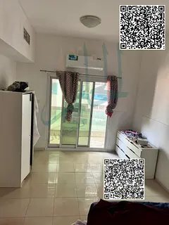One bedroom and living room for sale in Lulu Towers Ajman complex with an open view, ideal for real