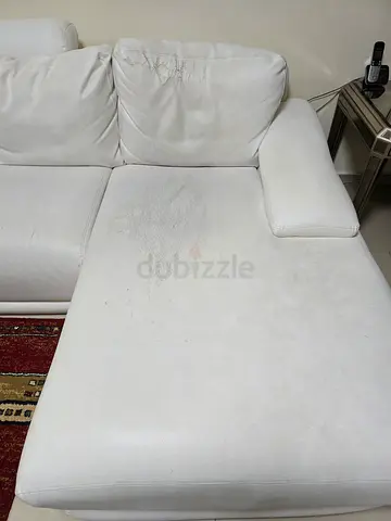 Cozy White Leather Seven Seater Sofa little damaged on 2 seats only.. Can be repaired and use..