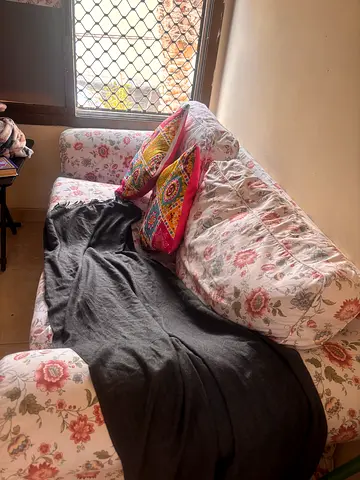 Cozy Floral Sofa with Colorful Cushions