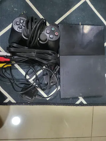 Classic Sony PlayStation 2 Console with Controllers and Accessories