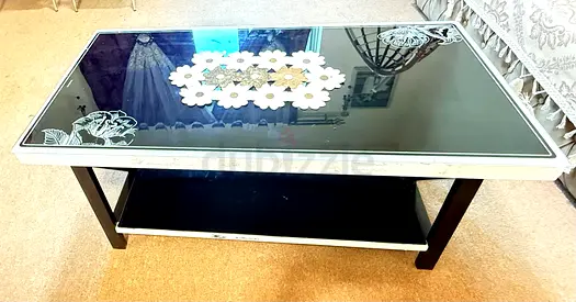 Elegant Black Glass Coffee Table with Floral Design