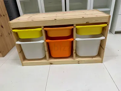 Stylish Wooden Storage Unit with Colorful Bins