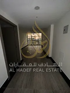 For rent in Sharjah - Al Taawun, a 3-bedroom apartment with a large balcony, built-in wardrobes, in
