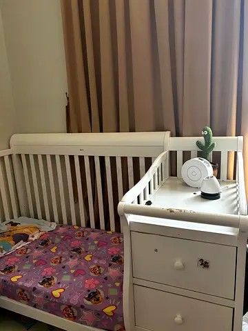 Charming White Baby Crib with Drawer