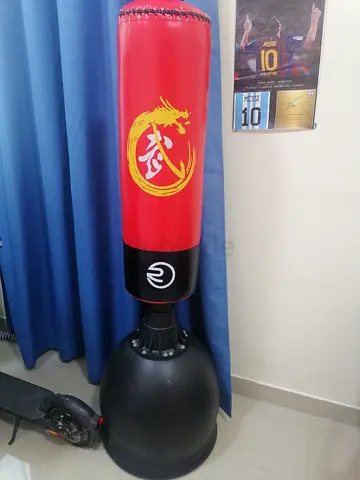 Punching bag with stand and boxing gloves