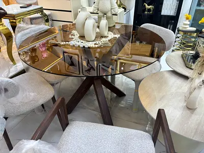 Elegant Round Glass Dining Table with Stylish Chairs