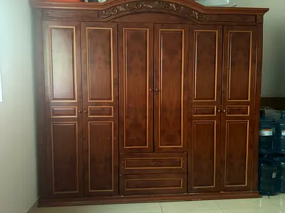 Elegant Wooden Armoire with Storage Drawers