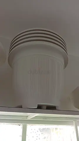 Stylish White Decorative Planter with Stripes