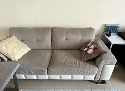 Comfortable Beige Sofa with Pillows