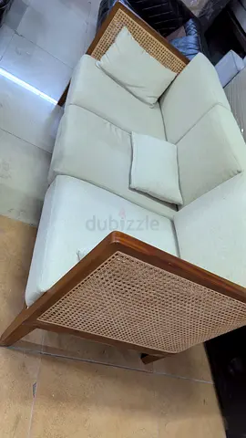Stylish and Comfortable Sofa with Rattan Accents