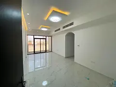 Available now for annual rent in Ajman: spacious 2-bedroom apartment with a balcony, 2 bathrooms, an