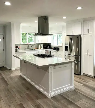 Modern White Kitchen with Island and Stainless Steel Appliances