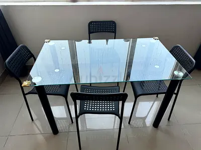 Modern Glass Dining Table with Stylish Chairs