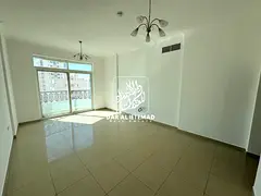 Spacious Living in Al Mujarrah: 1BHK w/ Balcony &amp; Covered Parking