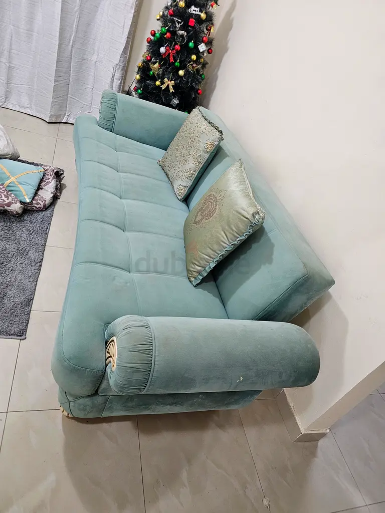 Comfortable Mint Green Sofa with Cushions