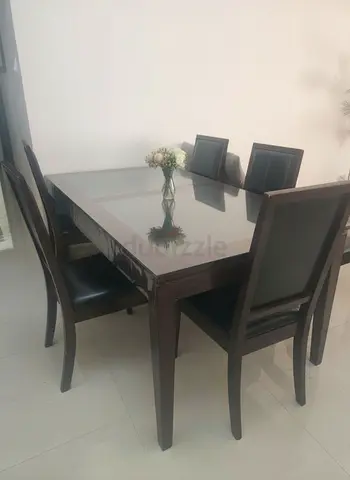 Elegant Glass Dining Table with  Black Chairs
