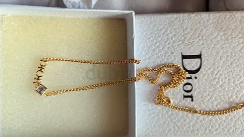 Elegant Dior Gold Necklace with Sparkling Charm