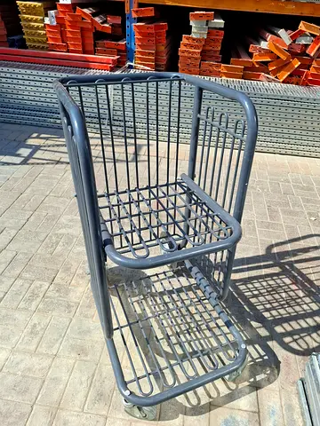 heavy-duty carryout cart, also known as a handcart or specialty shopping cart. It is designed to tra