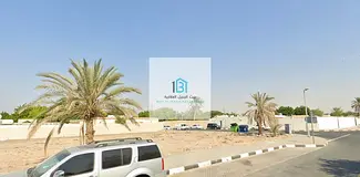 Prime Residential Plot in Al Khuzamiyah – Corner plot facing two asphalt roads, second plot from t