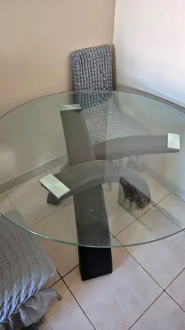 Elegant Round Glass Dining Table with Unique Base