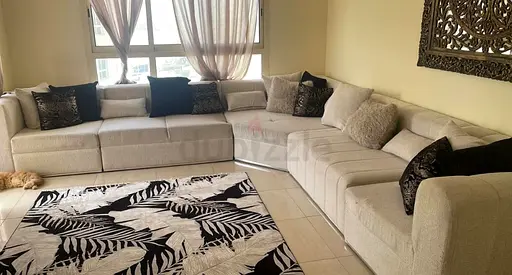 Cozy L-Shaped Sofa with Chic Rug