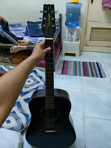 Striking Black Acoustic Guitar for Sale