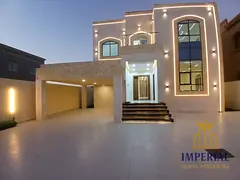 A luxurious villa for sale in Al Muwaihat 1, Ajman, boasting an exceptional location directly behind