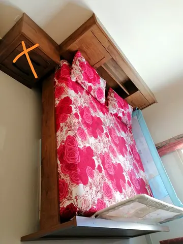 Charming King Size Wooden Bed alongwith mattress from Pan Emirates without side tables.