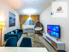 Sharjah Al Taawun, two-bedroom apartment, hall, kitchen, two bathrooms and balcony