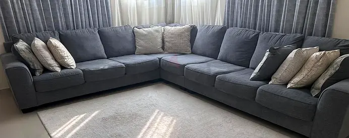 Comfortable Grey Sectional Sofa with Decorative Cushions