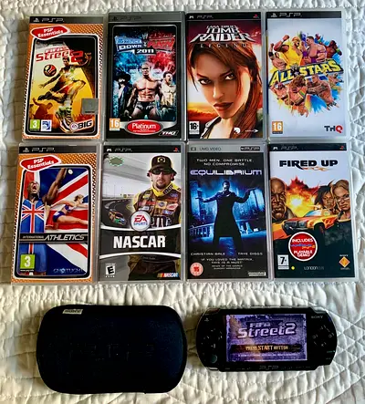 SONY PSP 1000 with 8 UMD GAMES + Memory Card + Pouch + Charging Cable.