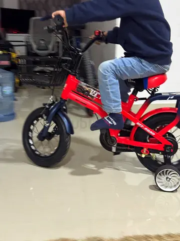 Kids Red Sports Bicycle with Training Wheels. Good for 3 to 5 years old. Only used few times
