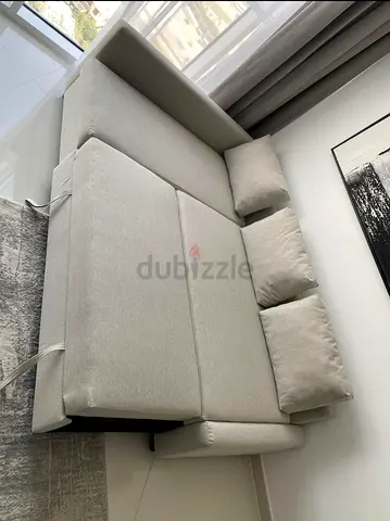 Comfortable L-Shaped Sofa with Cushions