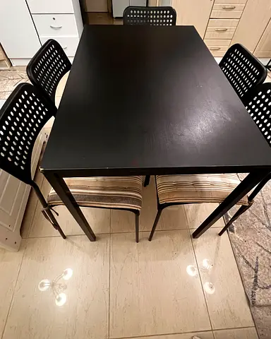 Stylish Black Dining Table with Comfy Chairs